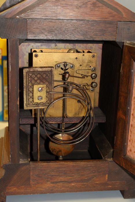 A late 19th century mantle clock, the architectural oak case containing an eight day movement - Image 2 of 2