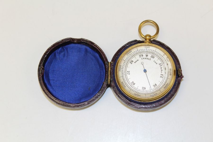 An Edwardian brass 5cm pocket barometer, in leather outer case