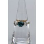 An early 20th century blue Zircon and diamond set trilogy ring. Set in yellow and white metal