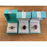 Three gold gem set rings. Comprising a 9ct gold sapphire and diamond set cocktail ring, size M1/2,