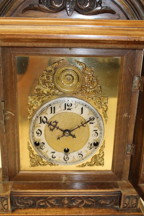 A late 19th century German mantle clock, the domed walnut case enclosing an eight day gong - Image 2 of 3