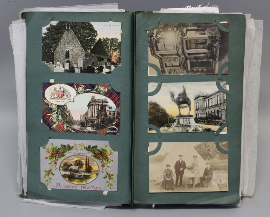 An Edwardian postcard album, containing several dozen cards, including regimental and other
