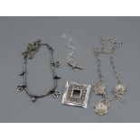 A selection of Traidcraft silver jewellery comprising a filligree necklace, a cross, a bracelet