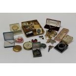 A quantity of silver and costume jewellery to include brooches, chains, compact mirrors, earrings,