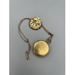 A yellow metal watch case converted into a locket. With an ivy leaf engraved pattern, but