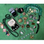 A collection of antique and vintage costume jewellery. To include an inlaid slate brooch; an