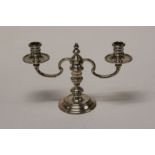 Richard Comyns, an Elizabeth II silver table candlestick with detachable two arm sconces on