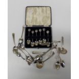 A cased set of six 1935 Silver Jubilee coffee spoons, together with six bright cut silver teaspoons,