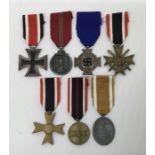 A collection of WW2 German medals. To include: an Iron Cross 2nd Class with makers mark ‘4’ on