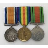 A WW1 British medal pair, plus WW2 era Defence Medal, mounted for wear on a pin back bar. Notes:
