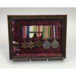 A WW2 Royal Navy medal group, framed and glazed, attributed to G.C.Christopher C/KX 128210.