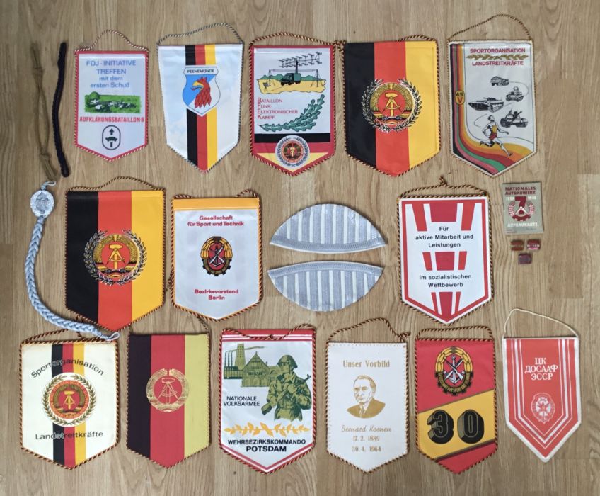 A selection of post war East German DDR, insignia and pennants. To include: a pair of matched