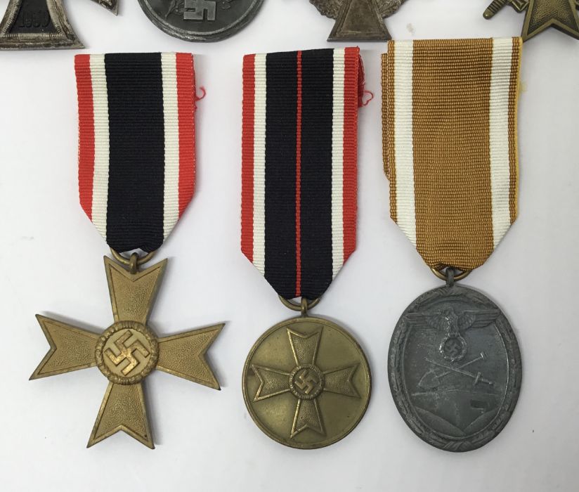 A collection of WW2 German medals. To include: an Iron Cross 2nd Class with makers mark ‘4’ on - Image 3 of 5