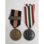 2 WW2 era German medals. To include: a Sudentenland Medal with Prague Castle Bar, plus a Memel