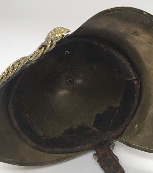 A late 19th / early 20th century brass fireman’s helmet by Merryweather & Sons of London. Standard - Image 9 of 10