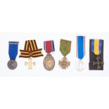 A selection of foreign decorations and medals.To include: a South African John Chard medal, an