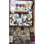 Collection of military items, including US medals, British cap badges & buttons with other items.