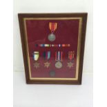 A glazed and framed WW2 / Fire Brigade Long Service Medal group. To include: Atlantic Star with