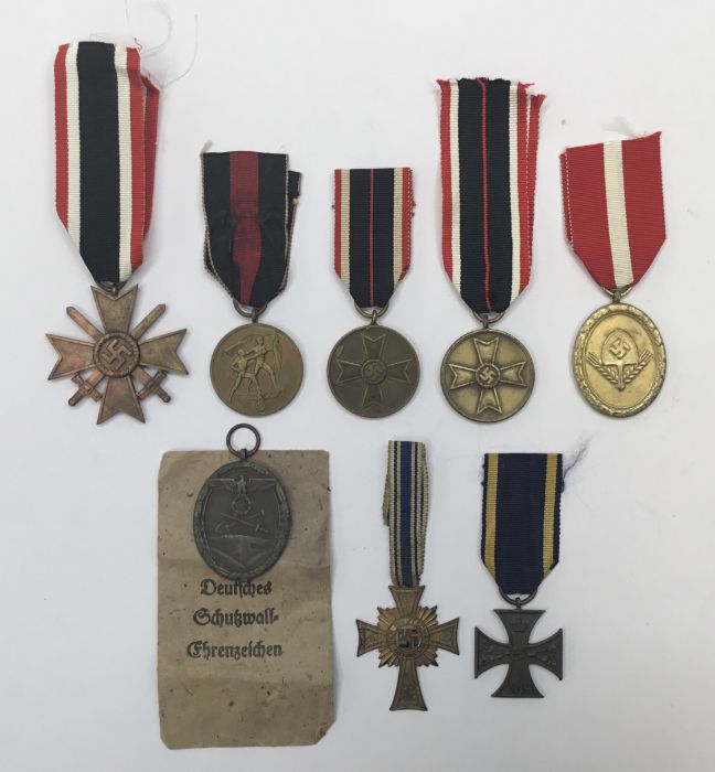 A selection of German WW2 and earlier medals. To include: a War Merit cross with swords (marked 33
