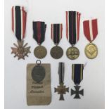 A selection of German WW2 and earlier medals. To include: a War Merit cross with swords (marked 33