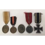 A selection of German WW1 and WW2 medals / badges. To include: a West Wall medal with ribbon, a