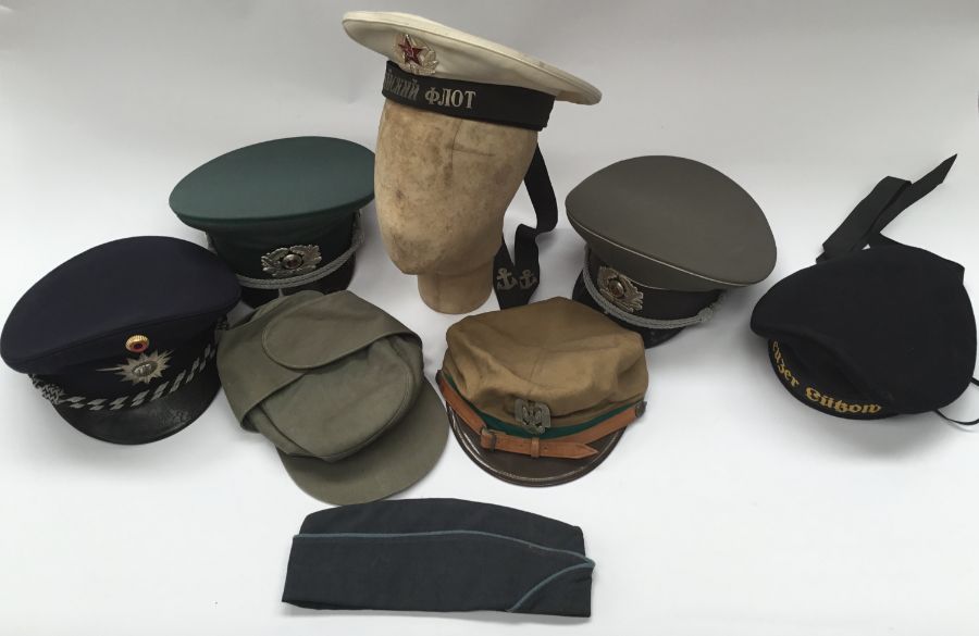 A selection of post WW2 European military caps. To include: 4 East German examples, a German naval