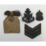 A collection of WW1 and later military interest items. Including a piece of WW1 German shrapnel with