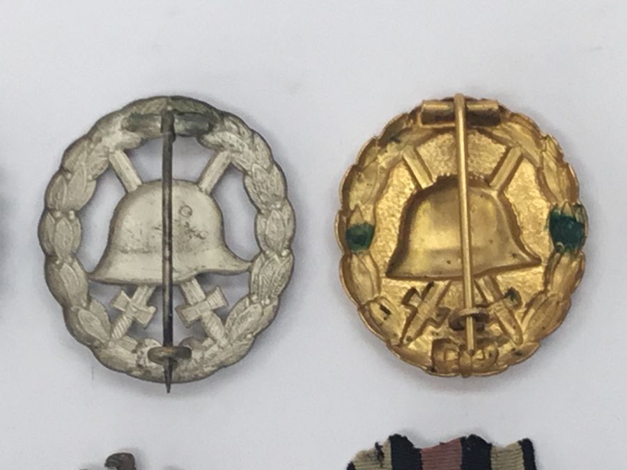 A selection of WW1 and WW2 German medals, badges and insignia. To include: a WW2 war merit cross - Image 9 of 15