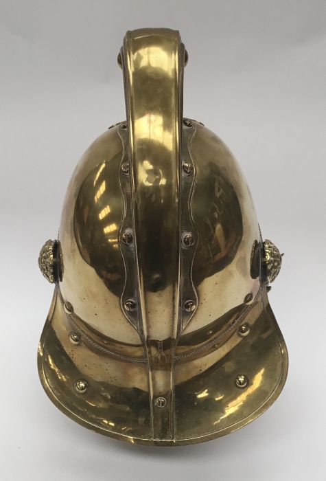 A late 19th / early 20th century brass fireman’s helmet by Merryweather & Sons of London. Standard - Image 8 of 10