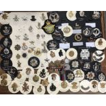 Large collection of British Military cap badges with two 1939-45 stars one with ribbon & other