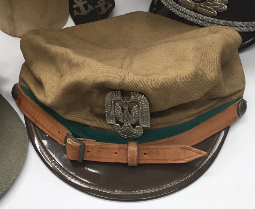 A selection of post WW2 European military caps. To include: 4 East German examples, a German naval - Image 5 of 9