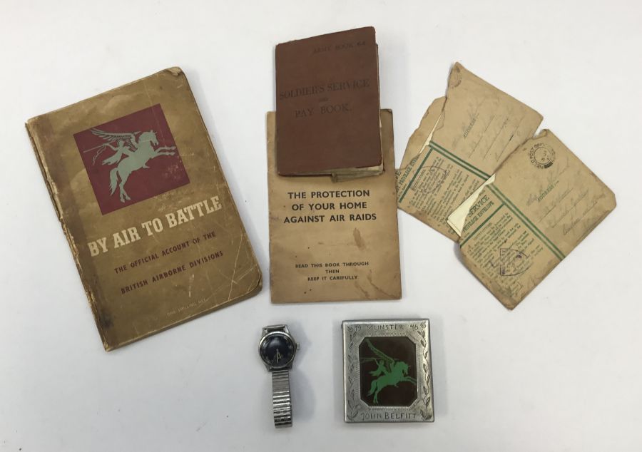 A WW2 German military wristwatch by Helios, together with a hand made aluminium cigarette case,