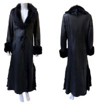 A full length coat by Sued Mod C2005 made from butter soft black leather with a black shearling