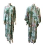 A vintage Japanese silk kimono or robe in great condition. On the minty green ground are motifs of