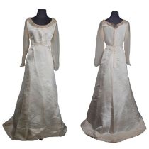 A late Edwardian wedding dress in Silk with crepe chiffon yoke and sleeves along with two veils, one