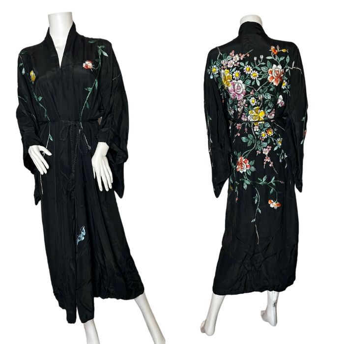 A C1920s/ 30s hand embroidered kimono robe in black rayon silk with a black rayon lining. The design