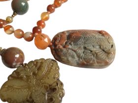 Two vintage Chinese agate sautoir necklaces, probably 1920s. One is hand knotted with a carved