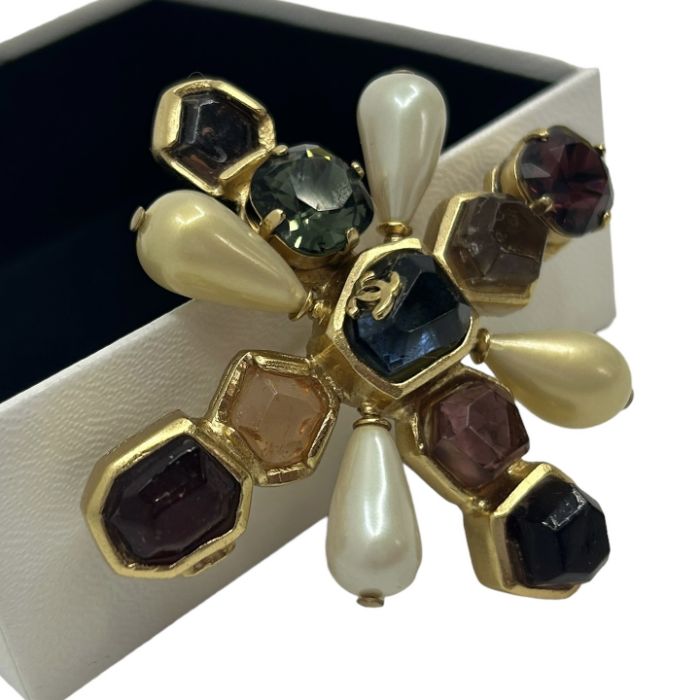 A Chanel brooch in a Byzantine style. Rough cut glass sits in a gold tone cross with two cushion cut - Image 2 of 3