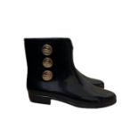 A pair of Vivienne Westwood Anglomania & Melissa ankle boots in black with gold Vivienne Westwood