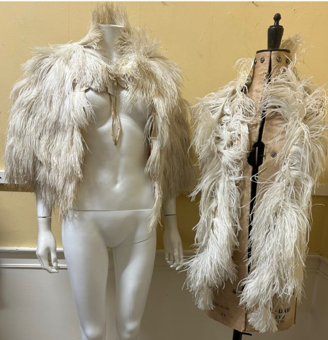 A 1920s/ 30s ostrich feather cape with rayon lining and ties and a similar ostrich feather boa. (