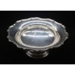 A George V silver footed dish with Chippendale style bordering rim, of simple design, hallmarked