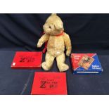 Three early to mid 20th Century wooden jigsaws, in original boxes, along with a vintage teddy