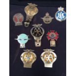 A collection of vintage car badges: RAC, AA, Civil Service and Order of the Road etc.