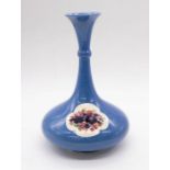 Moorcroft: A powder blue ground vase with floral panel design to body, signed and impressed to