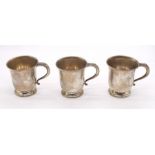 Three Modern silver baluster shaped tankards, scrolled handle, each inscribed E. Tisdale, all