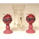 A pair of early 20th century pink glass lustres together with a single glass lustre.