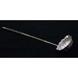 A George II silver toddy ladle, chased foliate and shell panels, twist handle, hallmarked London,