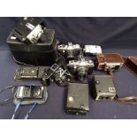 A collection of vintage and automatic cameras including lenses along with box of cameras including