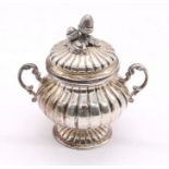 An Italian 800 silver two handled sugar bowl and cover, the cover with acorn finial above fluted