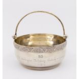 A Russian 875 silver sugar bowl with swing handle, with inscription dated 1934 to body, approx 115.7